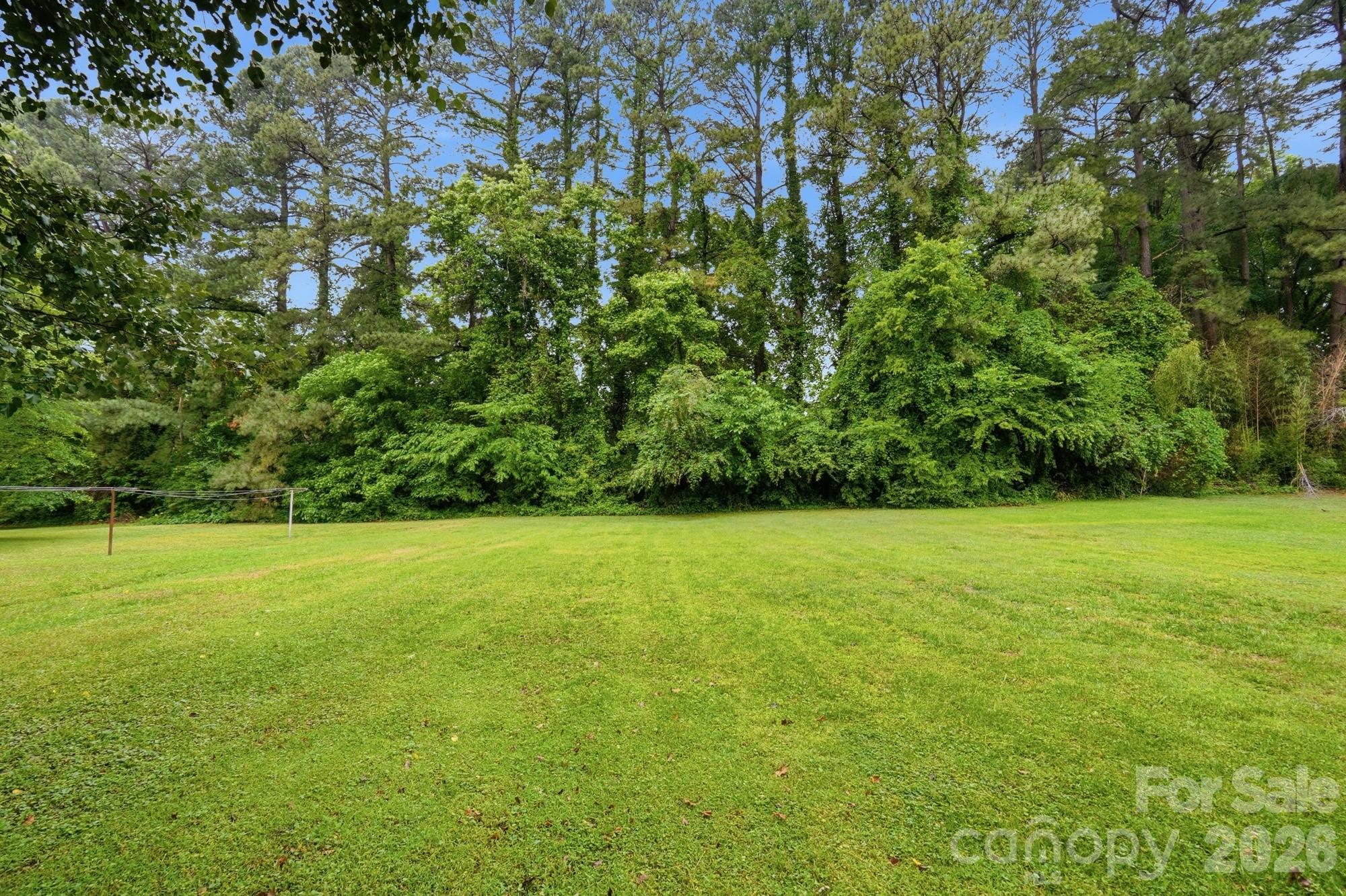 1235 Winecoff School Road Concord, NC 28027 - Photo 25 of 27 a view of a field with a trees