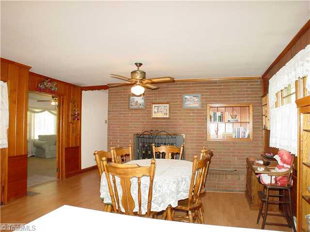 5016 Sitka Road Walkertown, NC 27051 - Photo 5 of 12 Breakfast. View of fireplace and built-in shelves in the breakfast area of the kitchen.