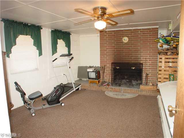 5016 Sitka Road Walkertown, NC 27051 - Photo 10 of 12 Den/Family/Great Room. Den located in basement. Not included in the finished sq ft.