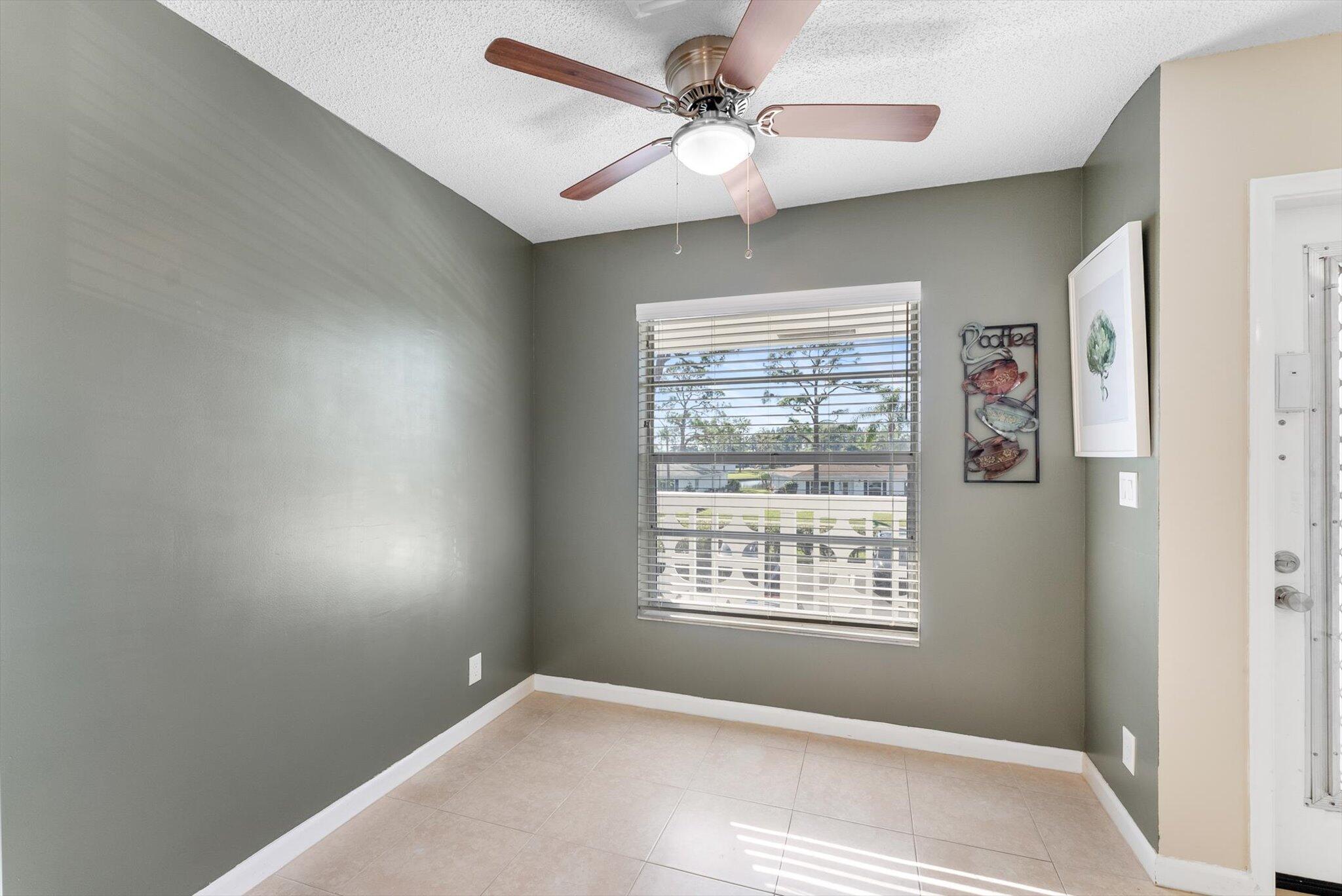 5321 Poppy Place, Unit 203 Delray Beach, FL 33484 - Photo 12 of 31 a view of an empty room with a window
