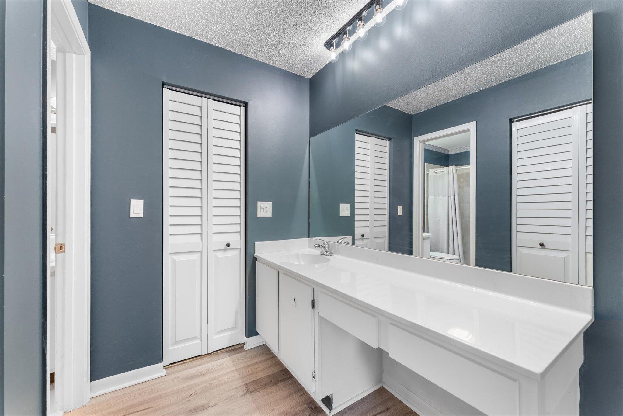 5321 Poppy Place, Unit 203 Delray Beach, FL 33484 - Photo 20 of 31 a room with a sink and a mirror