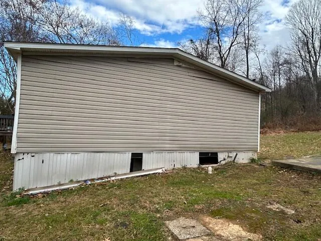 a backyard of a house with yard and seating space