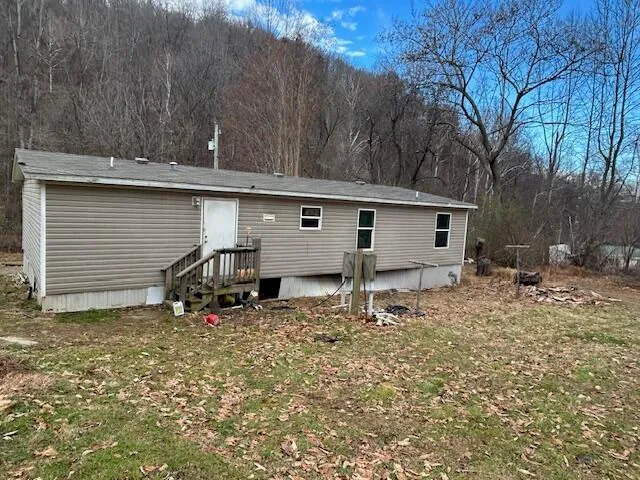 a view of a barn in the back yard
