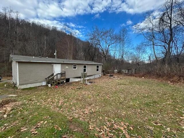 a view of a barn in the middle of a yard