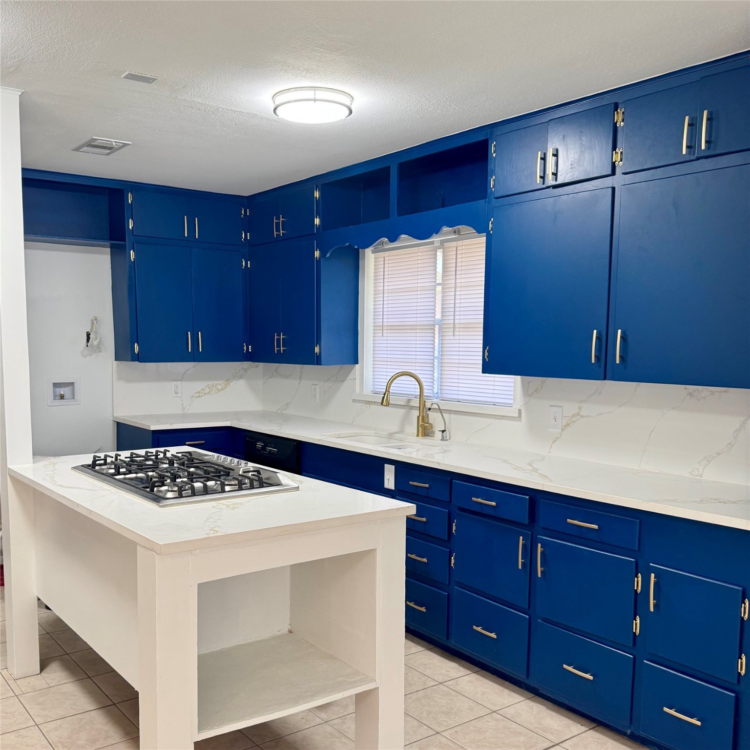 1701 Gillette Street Baytown, TX 77520 - Photo 4 of 21 a kitchen with stainless steel appliances granite countertop a sink stove and cabinets