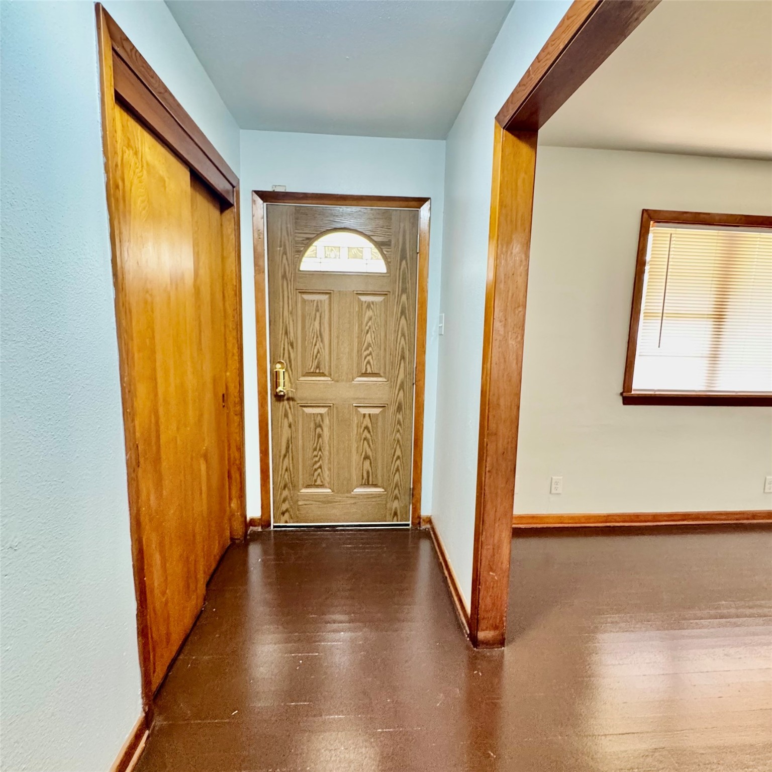 1701 Gillette Street Baytown, TX 77520 - Photo 9 of 21 a view of a hallway with wooden floor and windows