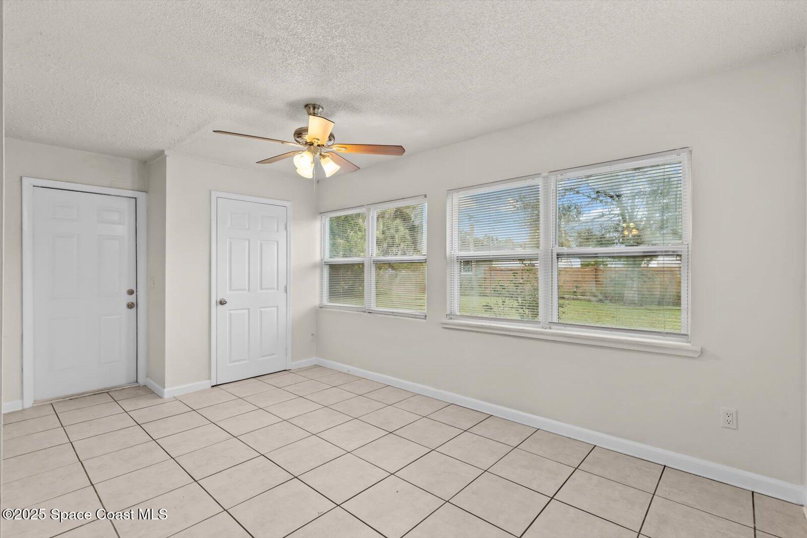7506 Roberts Road Fort Pierce, FL 34951 - Photo 11 of 33 a view of an empty room with a window