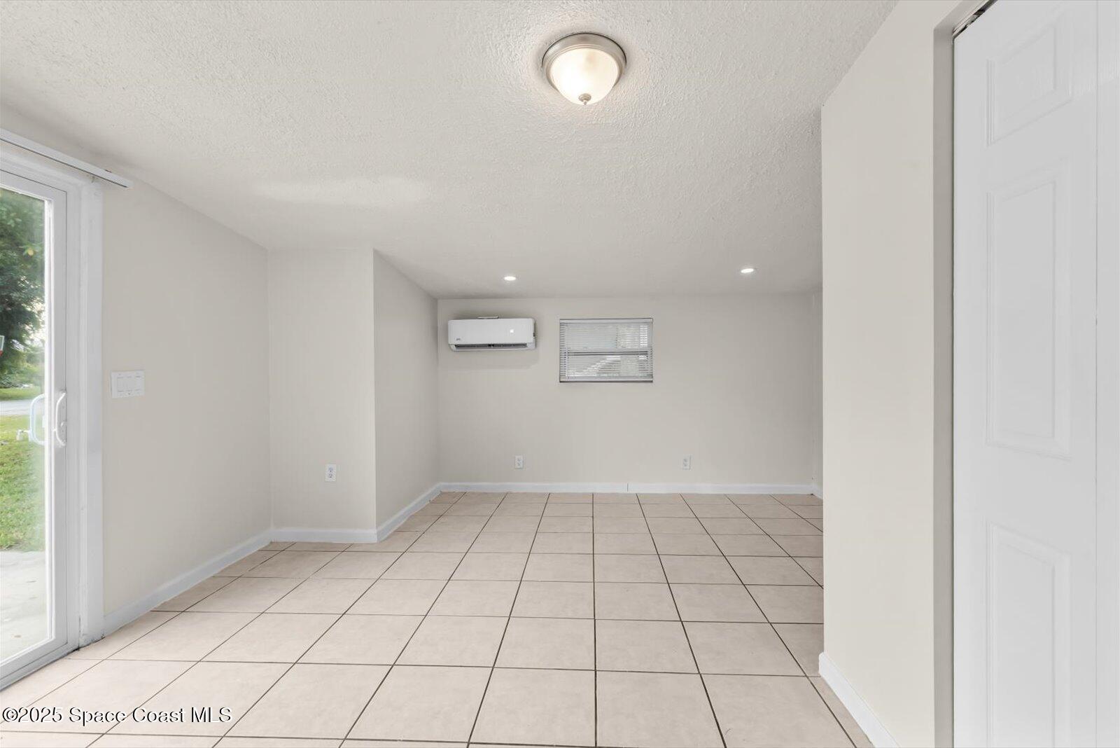 7506 Roberts Road Fort Pierce, FL 34951 - Photo 13 of 33 an empty room with windows and closet