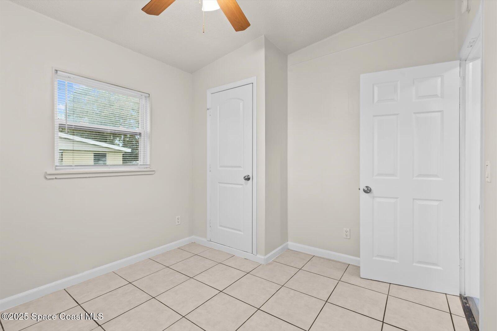 7506 Roberts Road Fort Pierce, FL 34951 - Photo 23 of 33 a view of an empty room and window