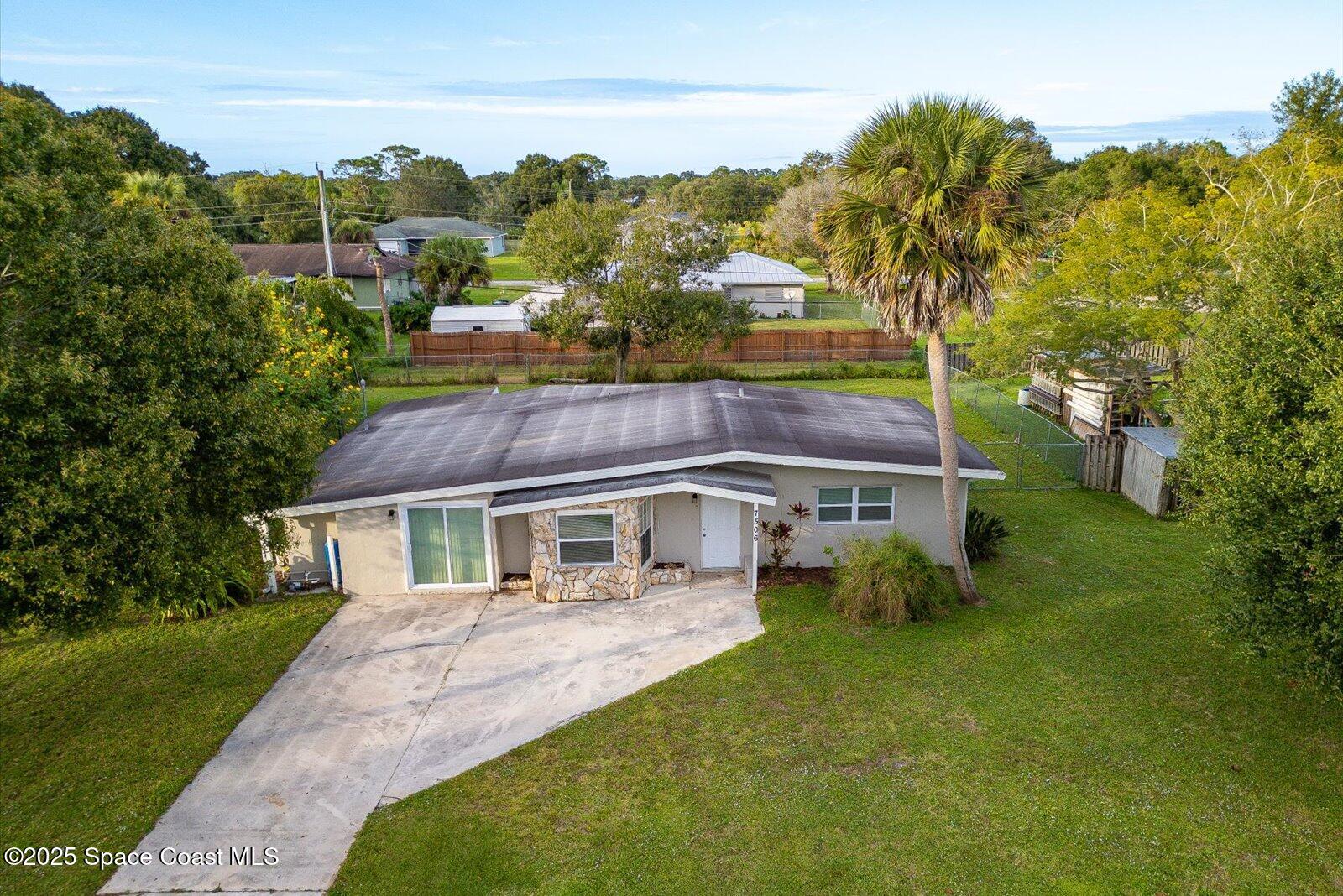 7506 Roberts Road Fort Pierce, FL 34951 - Photo 30 of 33 a aerial view of a house