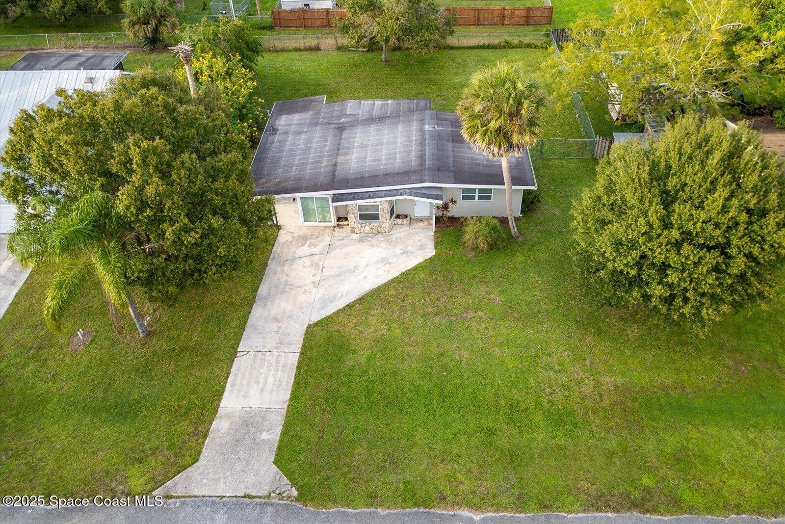 7506 Roberts Road Fort Pierce, FL 34951 - Photo 31 of 33 a aerial view of a house