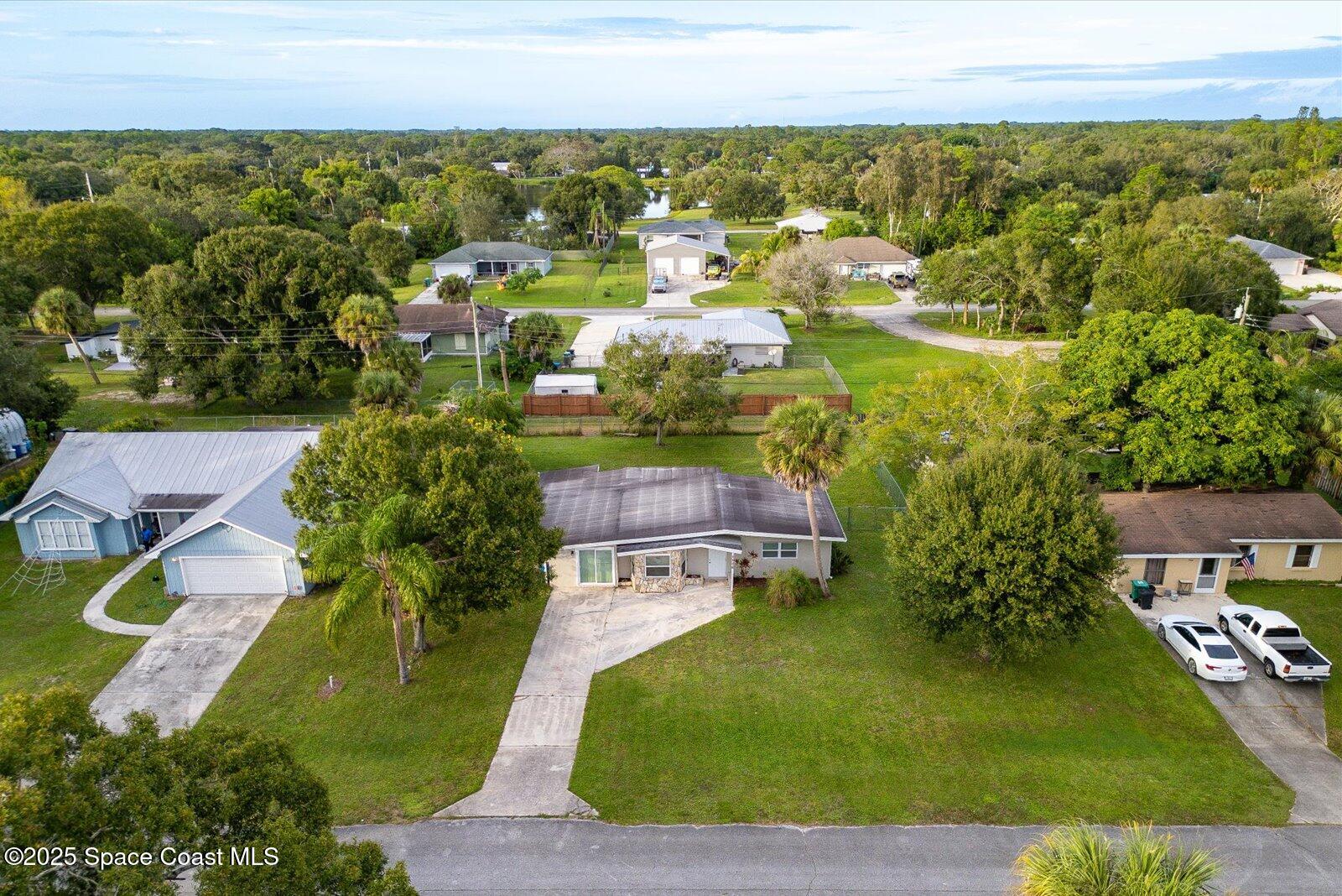 7506 Roberts Road Fort Pierce, FL 34951 - Photo 32 of 33 an aerial view of residential houses with outdoor space