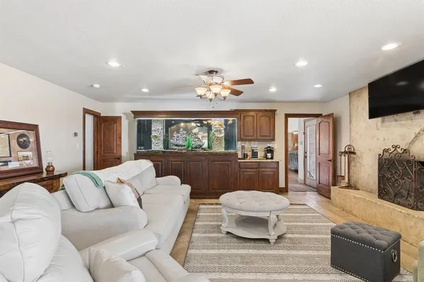 a living room with furniture and a large window