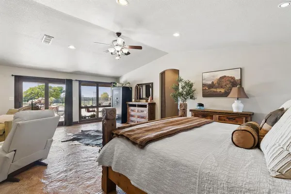a bedroom with furniture and window