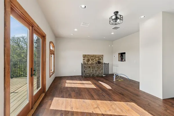 a view of an empty room and a window