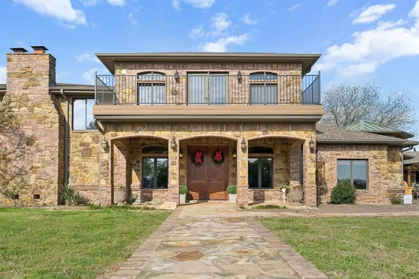 front view of a building with a garden