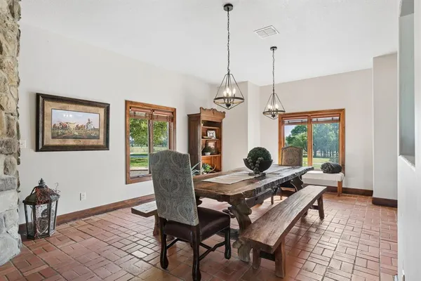 a living room with furniture a window and a chandelier