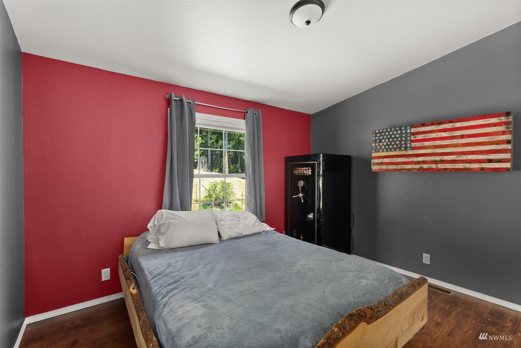 182 Holgate Lane Chehalis, WA 98532 - Photo 21 of 38 a bedroom with a bed and wooden floor