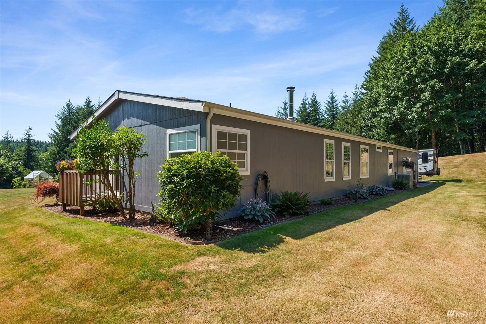 182 Holgate Lane Chehalis, WA 98532 - Photo 24 of 38 a front view of house with yard and trees around