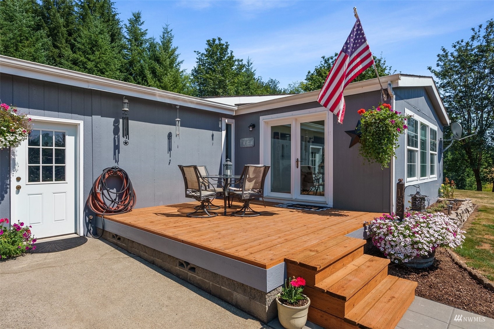 182 Holgate Lane Chehalis, WA 98532 - Photo 25 of 38 a view of a house with backyard sitting area and garden