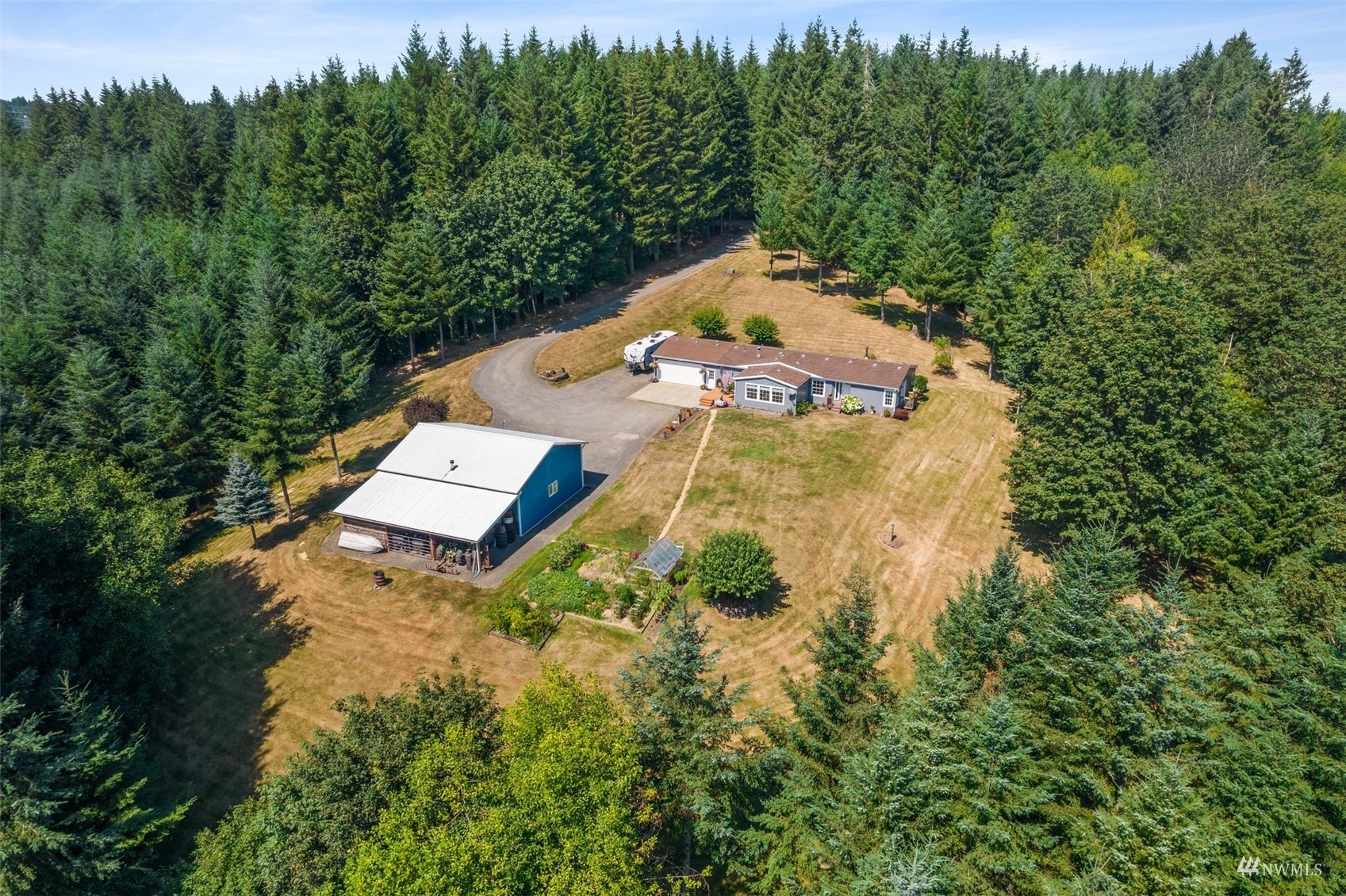 182 Holgate Lane Chehalis, WA 98532 - Photo 5 of 38 a view of a house with a yard and large trees