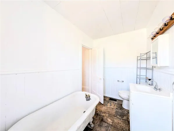 a bathroom with a bathtub and sink