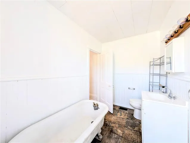 a bathroom with a bathtub and sink