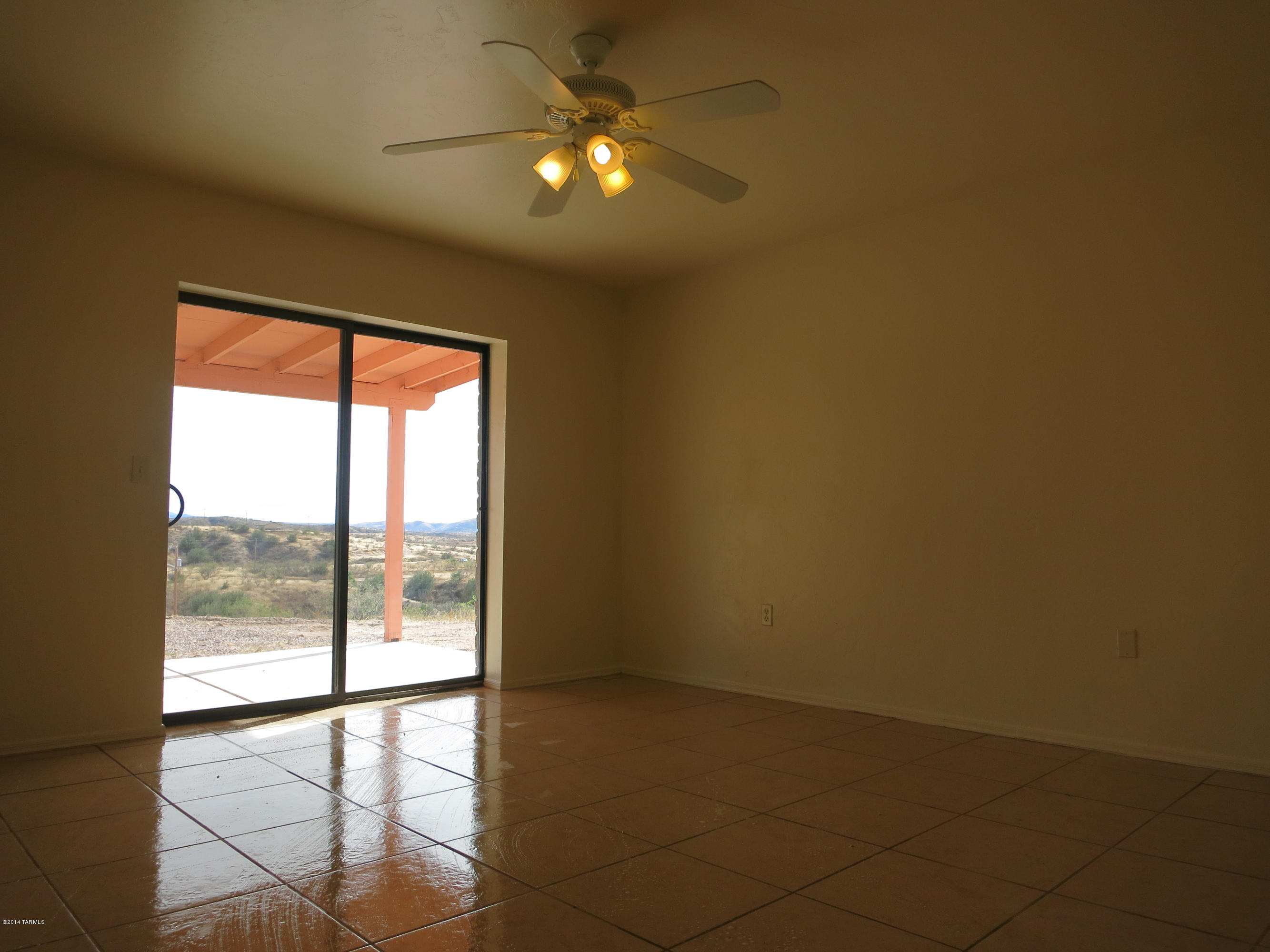 1055 Ameca Court Rio Rico, AZ 85648 - Photo 14 of 18 a view of an empty room with a window
