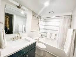 365 North Ocean Boulevard Boca Raton, FL 33432 - Photo 7 of 8 a bathroom with a granite countertop sink toilet and shower