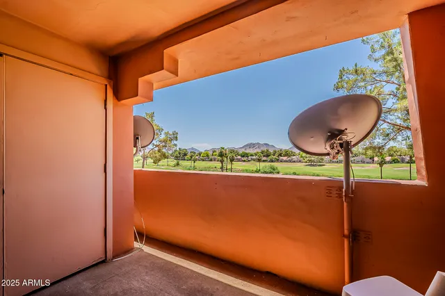 a view of a room with a table and a chair