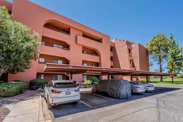 a view of a building with sitting area