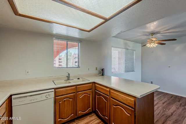 a kitchen with a sink and a window