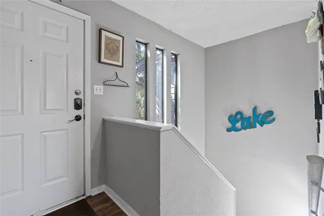 a view of an entryway with wooden floor