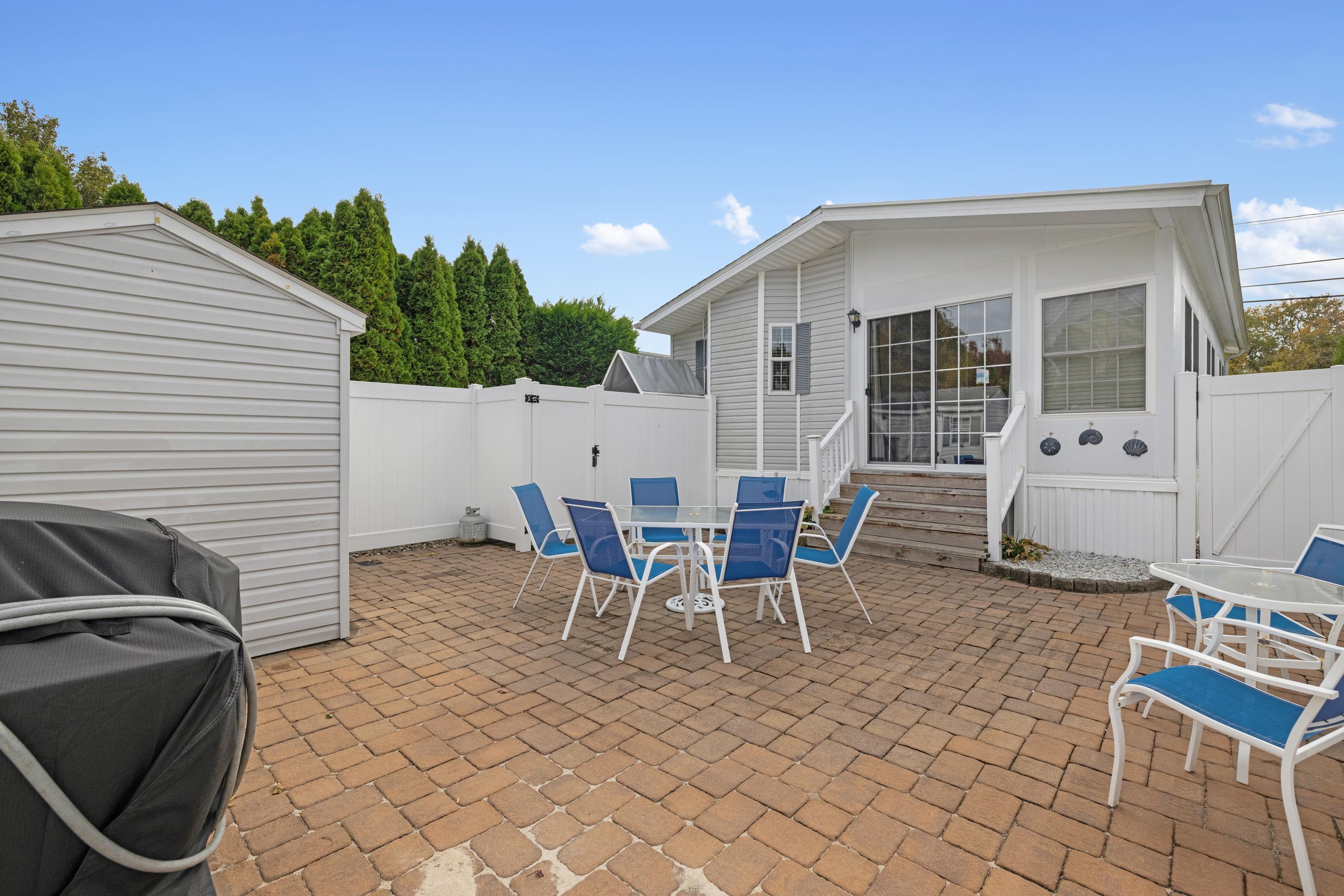 4100 Rte 9 South, Unit 6 Rio Grande, NJ 08242 - Photo 16 of 24 a view of a patio with table and chairs
