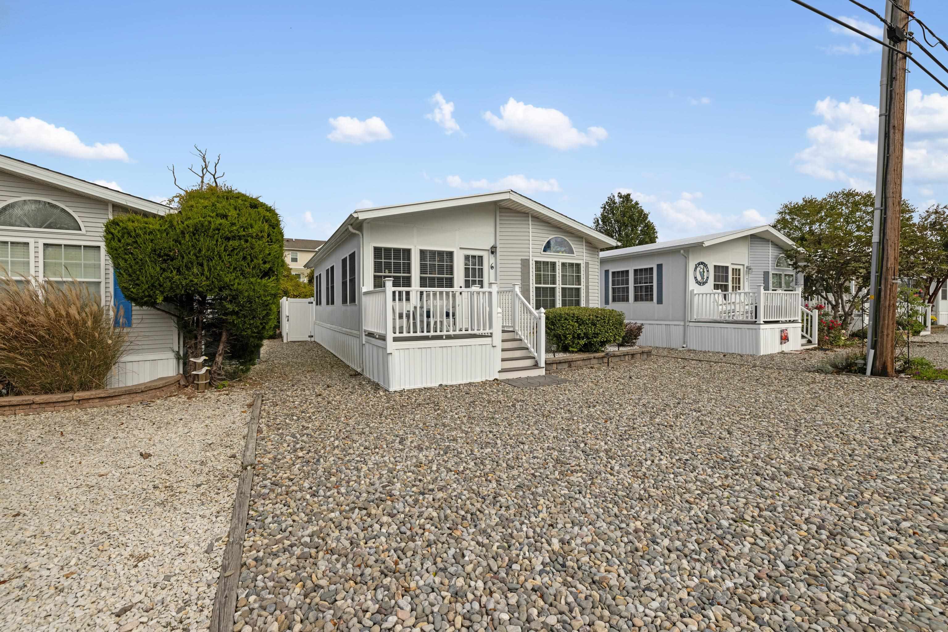 4100 Rte 9 South, Unit 6 Rio Grande, NJ 08242 - Photo 2 of 24 a view of a house with a yard and potted plants
