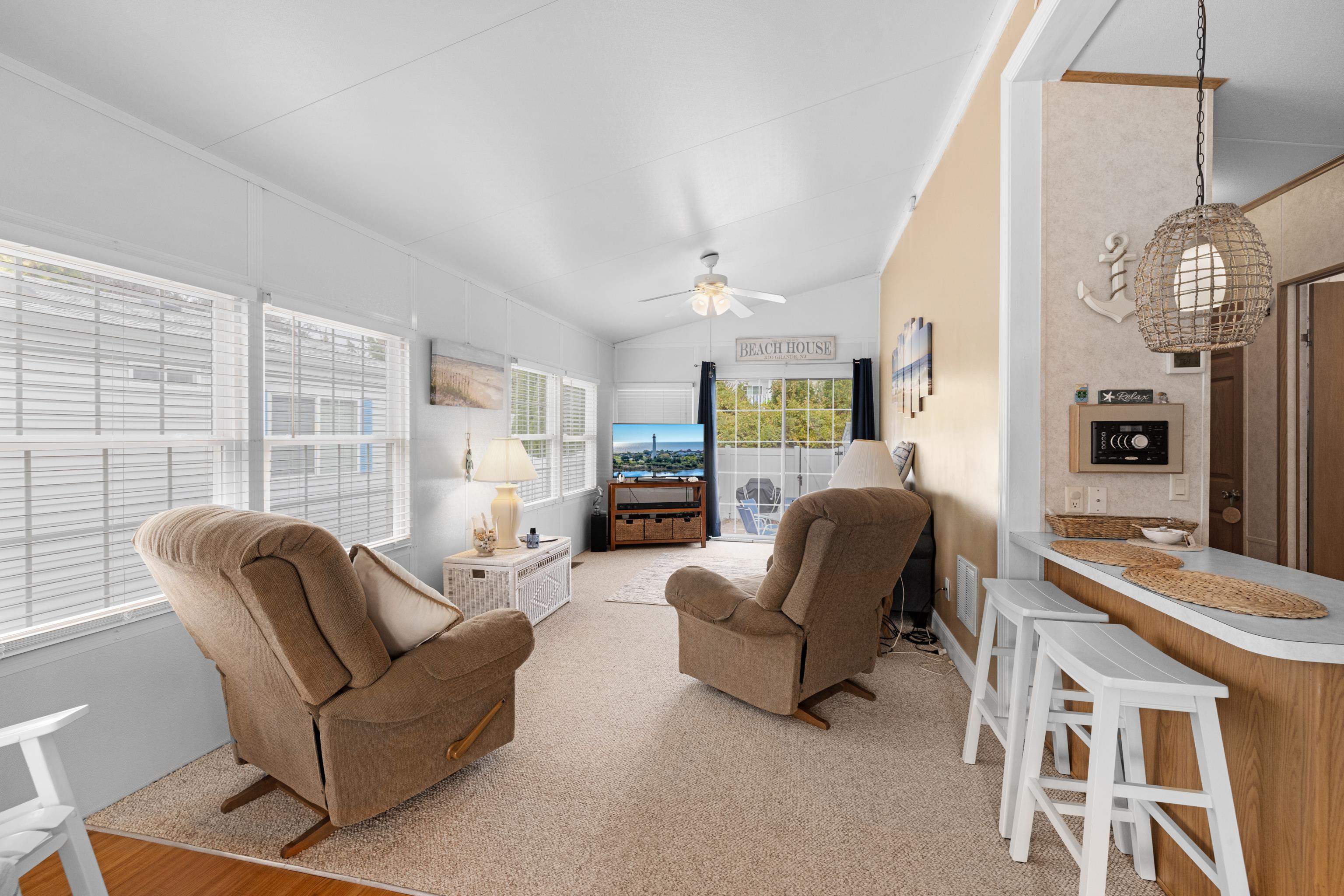 4100 Rte 9 South, Unit 6 Rio Grande, NJ 08242 - Photo 5 of 24 a living room with furniture and a large window