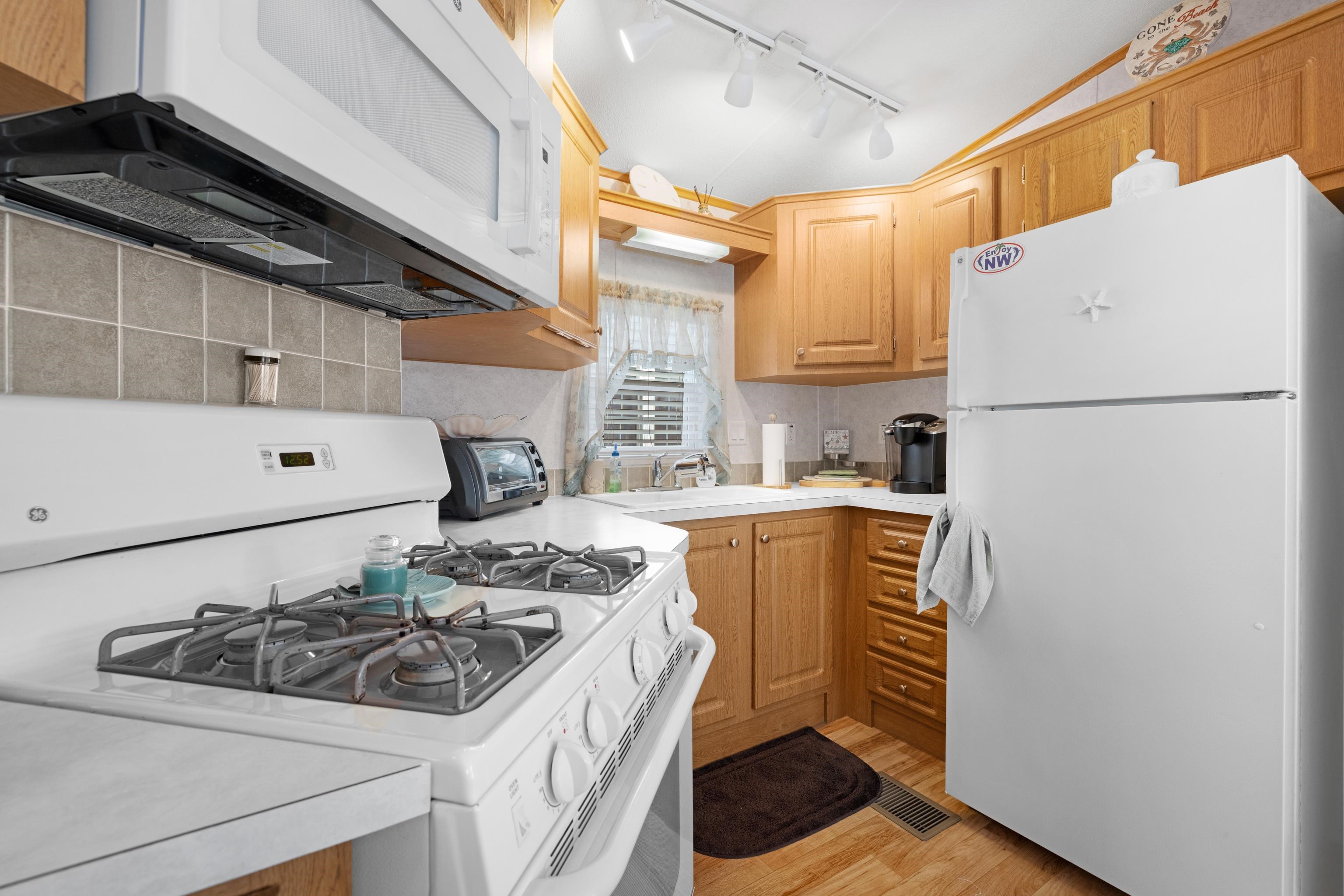 4100 Rte 9 South, Unit 6 Rio Grande, NJ 08242 - Photo 9 of 24 a white refrigerator freezer sitting inside of a kitchen