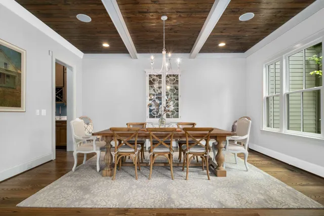 a spacious bedroom with a large bed and a flat screen television