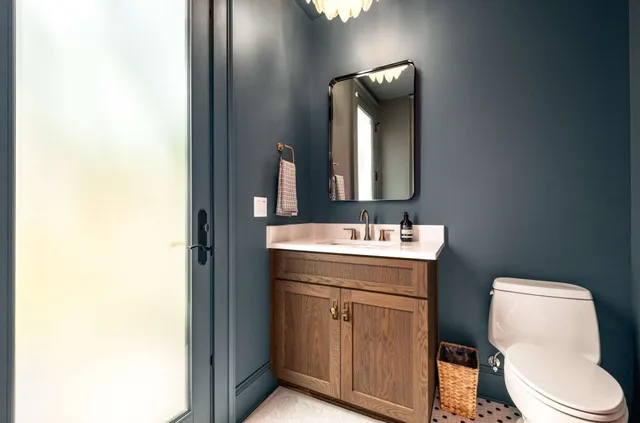 a living room with furniture a dining table and kitchen view