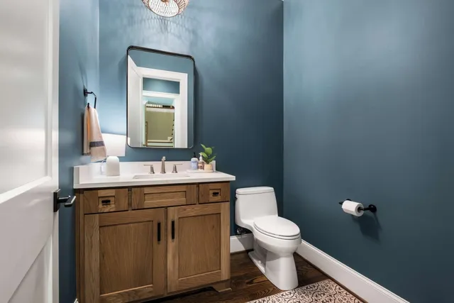 an aerial view of a house with a yard swimming pool and outdoor seating