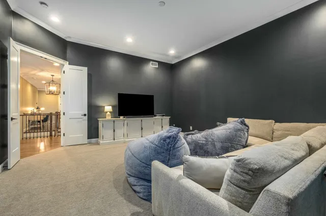 a view of a house with swimming pool and sitting area