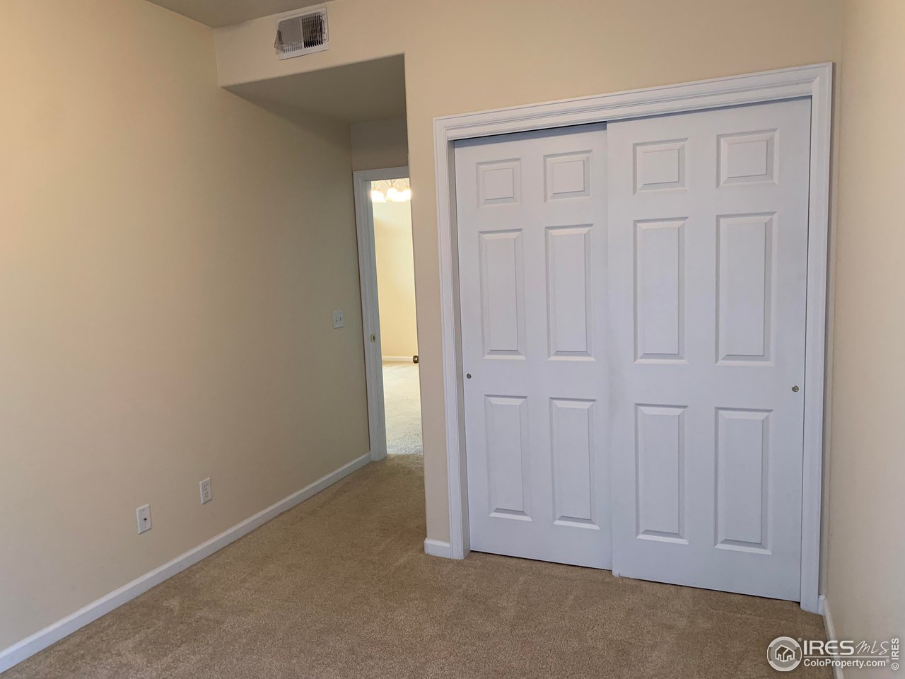 124 Beacon Way, Unit B Windsor, CO 80550 - Photo 13 of 26 an empty room with closet area