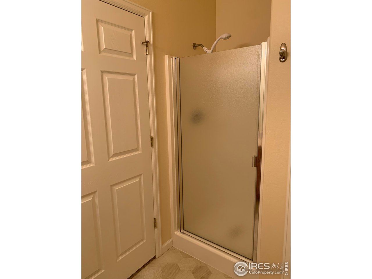 124 Beacon Way, Unit B Windsor, CO 80550 - Photo 15 of 26 a bathroom with a shower