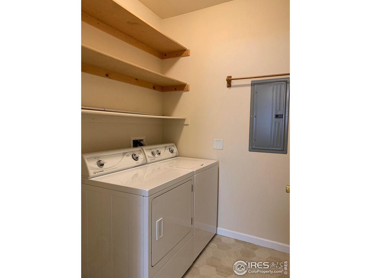 124 Beacon Way, Unit B Windsor, CO 80550 - Photo 16 of 26 a utility room with dryer and washer