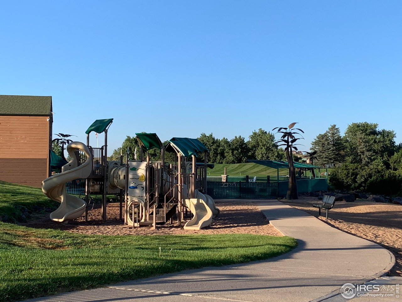 124 Beacon Way, Unit B Windsor, CO 80550 - Photo 17 of 26 a view of a park with swings