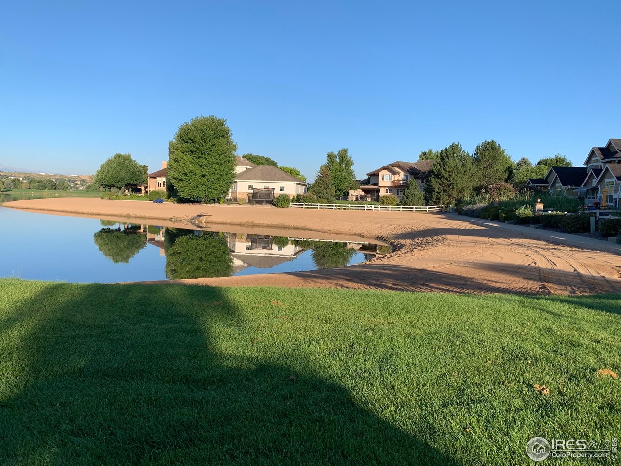 124 Beacon Way, Unit B Windsor, CO 80550 - Photo 19 of 26 a view of a swimming pool with an outdoor space and seating area