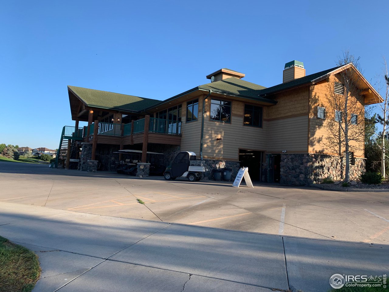 124 Beacon Way, Unit B Windsor, CO 80550 - Photo 22 of 26 a view of a house with a patio