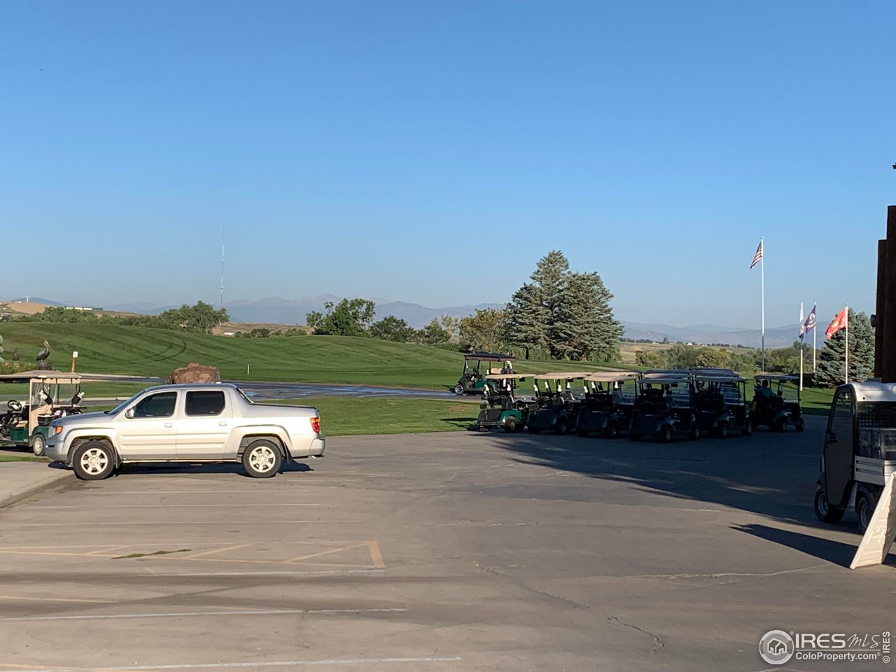124 Beacon Way, Unit B Windsor, CO 80550 - Photo 23 of 26 a car parked on the side of the road
