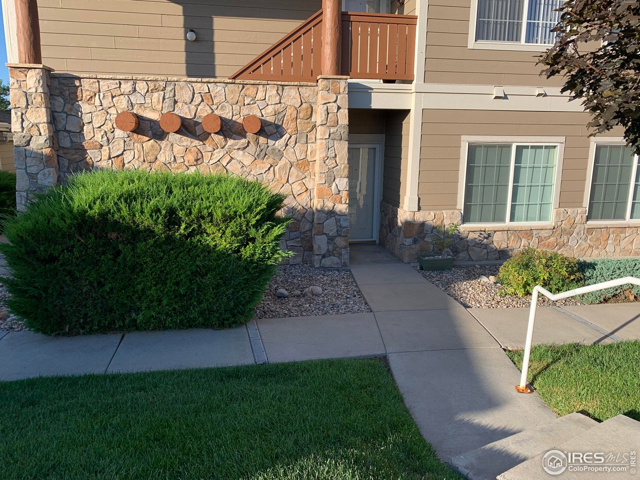 124 Beacon Way, Unit B Windsor, CO 80550 - Photo 26 of 26 a front view of a house with garden