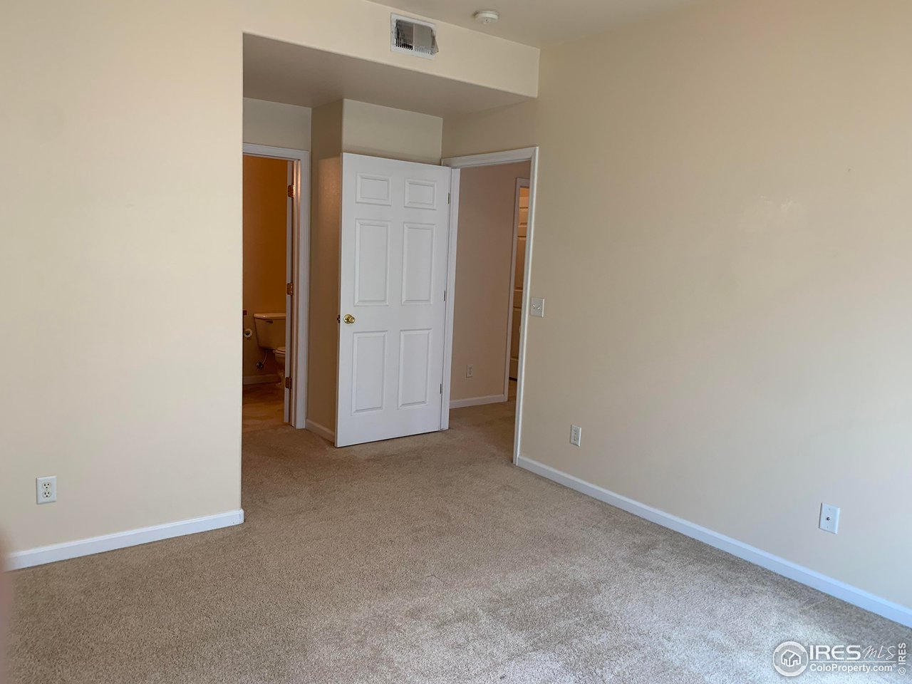 124 Beacon Way, Unit B Windsor, CO 80550 - Photo 8 of 26 an empty room with closet
